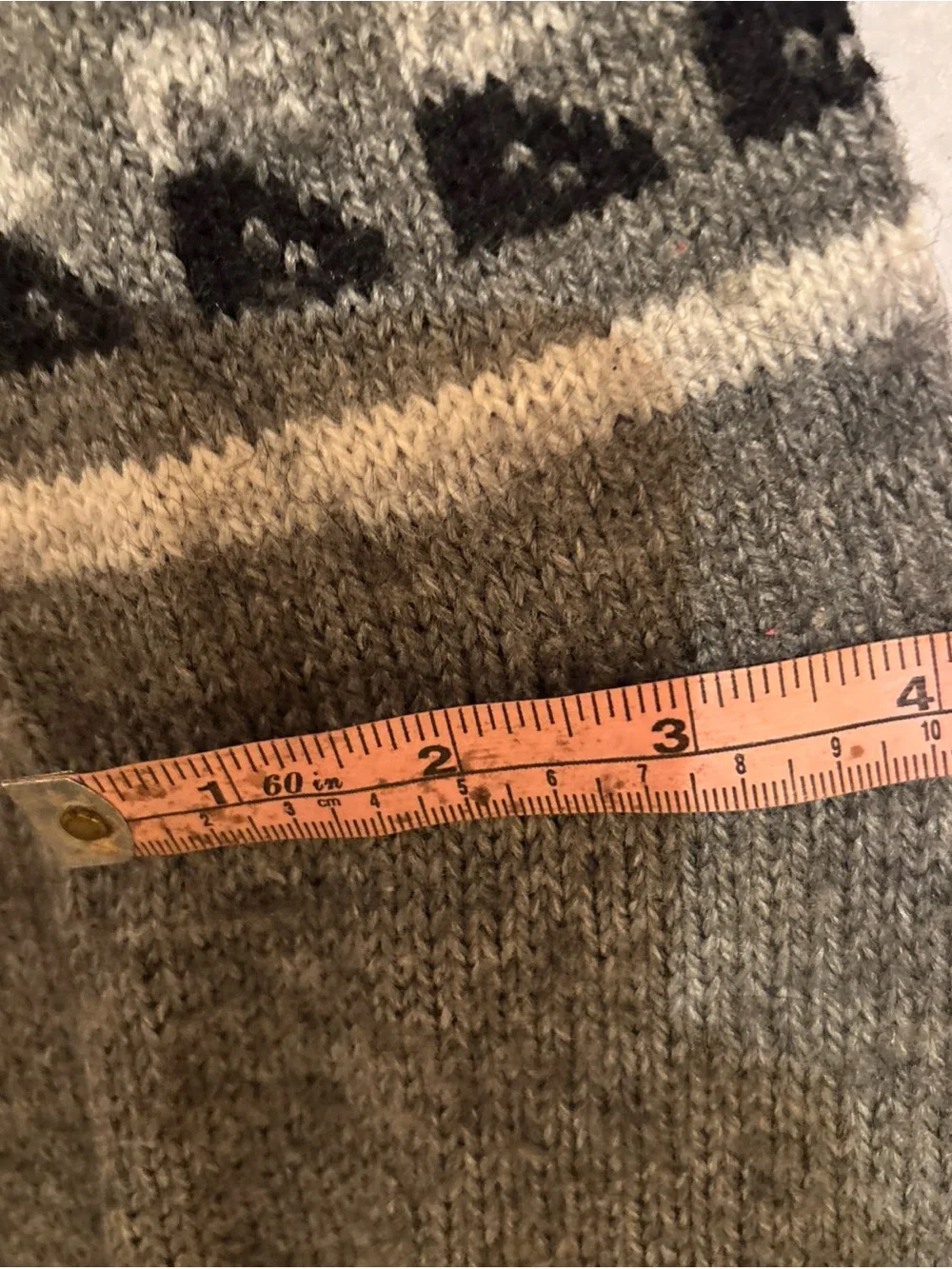 Hand knit alpaca wool for indoor slipper socks in grey, black and white.